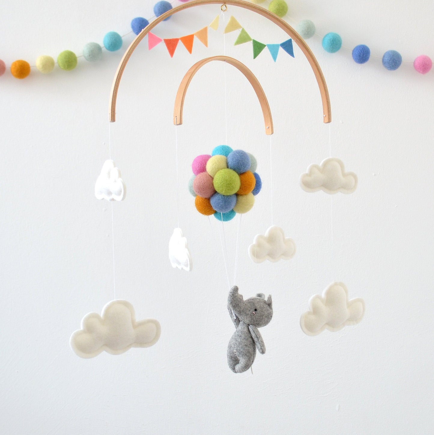 Rhino Flying with rainbow balloons